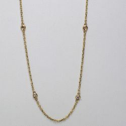 18' Diamonds by the yard necklace in yellow gold with bezel set (10) round diamonds.  D0.26ct.t.w.