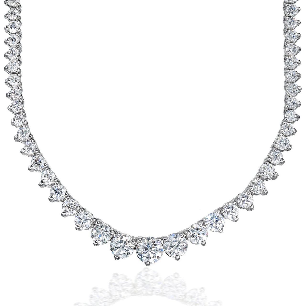 16.5' Graduated tennis necklace in 18K WG with 3-prong set round diamonds.  D18.10ct.t.w.  (Center 1.09ct.)
