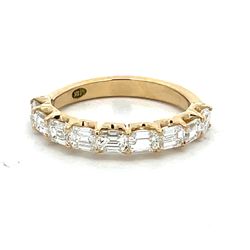 9-stone band east west style in 18K YG with prong set emerald cut diamonds.  D1.24ct.t.w.  Size 5