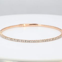 7'Lightweight flexible oval bangle in 14K RG with prong set round diamonds.  D1.04ct.t.w.