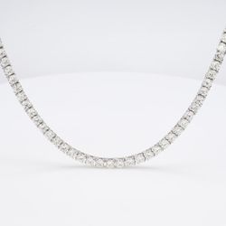 22' Tennis necklace with basket prong set (182) round diamonds.  D14.98ct.t.w.