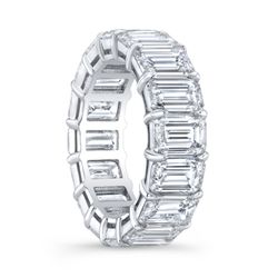 Eternity band in 18K WG with shared prong set emerald cut diamonds.  D3.90ct.t.w.  Size 5