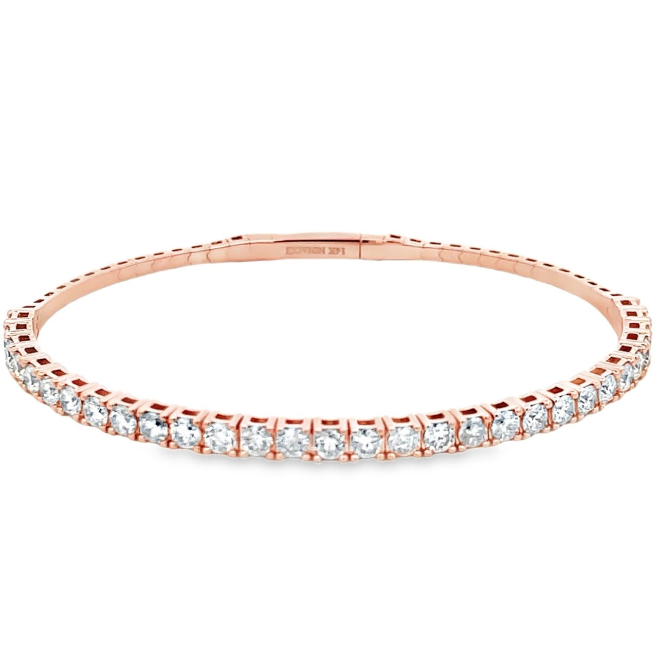 6.5' Light weight flexible oval shaped bangle in rose gold with prong set round diamonds.  D1.85ct.t.w.