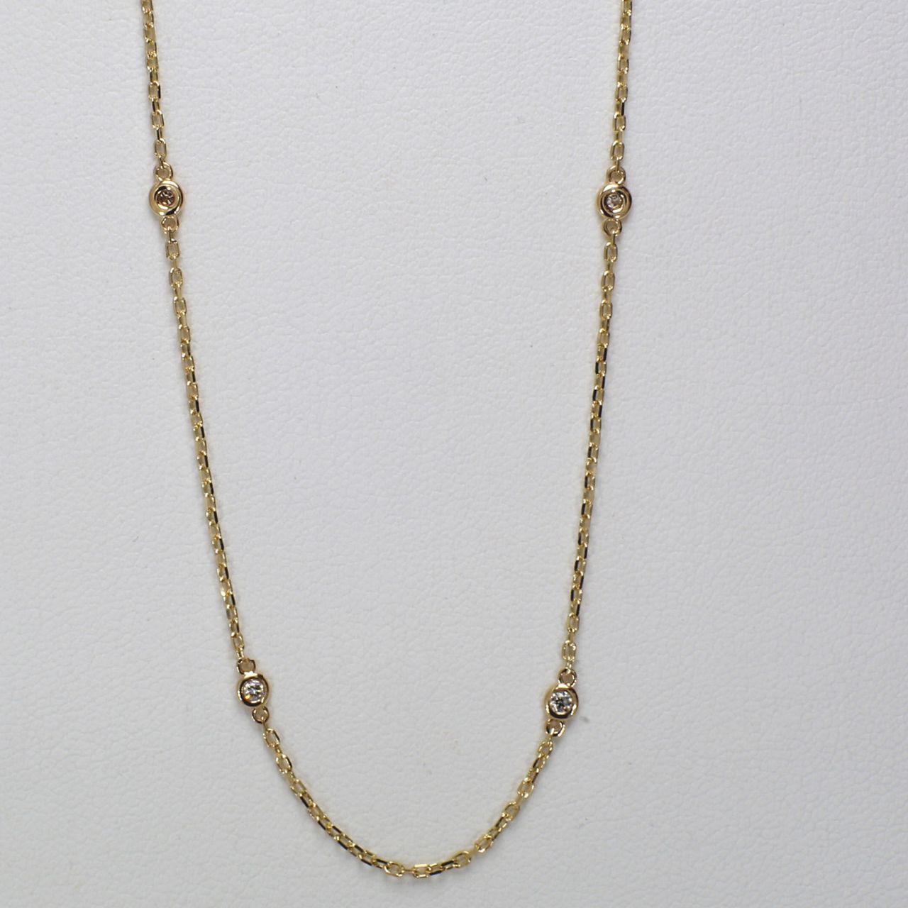 18' Diamonds by the yard necklace in yellow gold with bezel set (10) round diamonds.  D0.26ct.t.w.