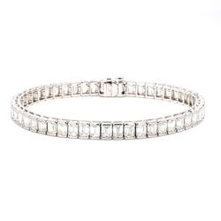 7' Tennis bracelet in platinum with half bezel set (51) emerald cut diamonds.  D15.68ct.t.w.