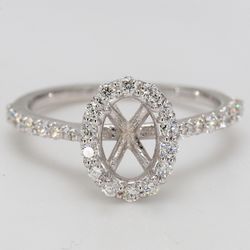 Halo semi-mount with shared prong set round diamonds.  D0.50ct.t.w.