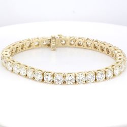7' Tennis bracelet in 18K YG with claw prong basket set (35) round diamonds.  D17.65ct.t.w.