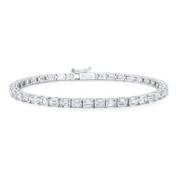 Tennis bracelet east west style in 18K WG with open basket prong set (56) emerald cut diamonds.  D5.29ct.t.w.