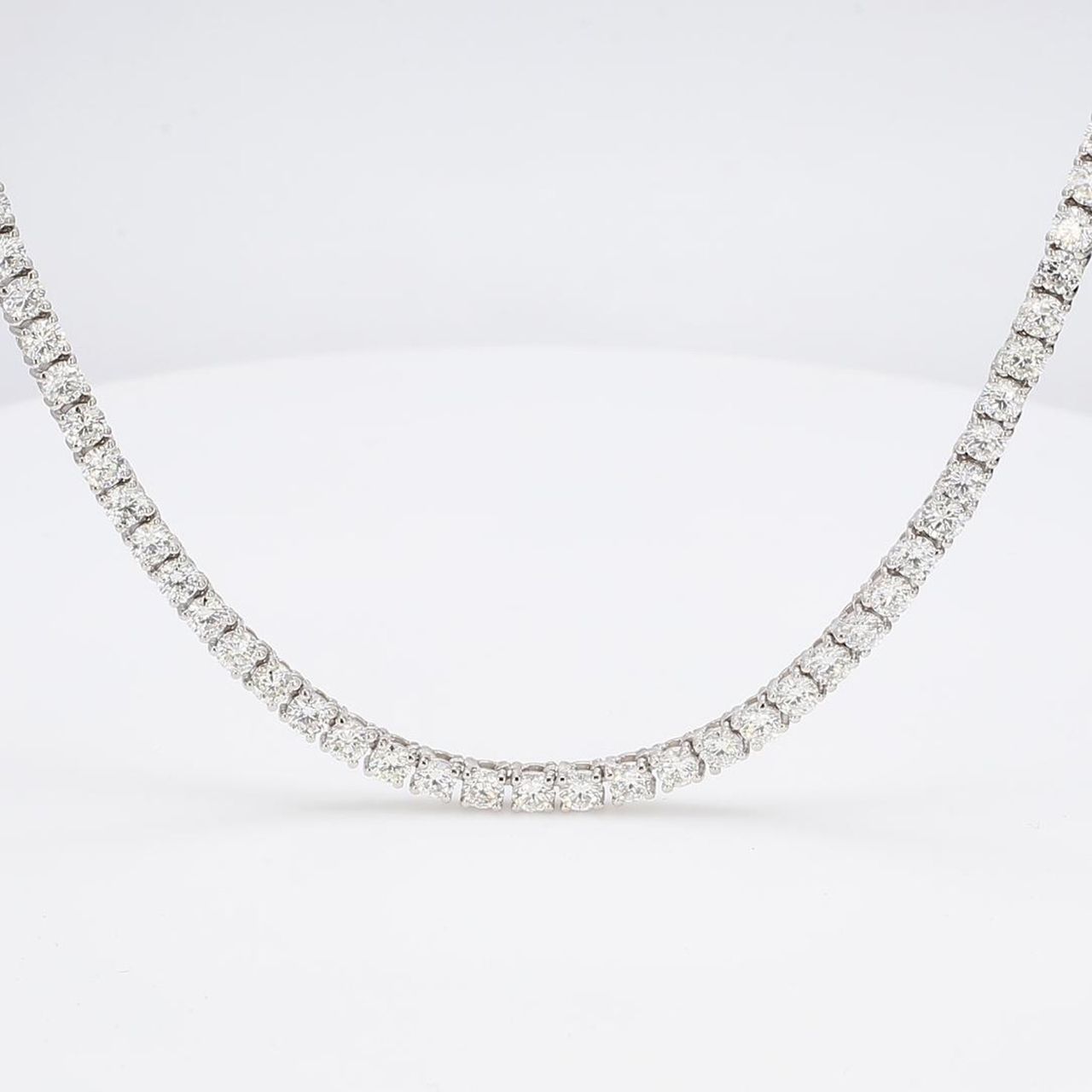18' Tennis necklace with 4-prong set (180) round diamonds.  D7.12ct.t.w.