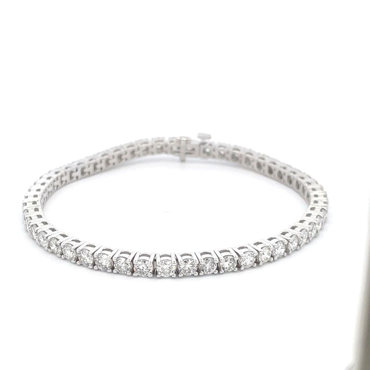 7' Tennis bracelet with 4-prong basket  set (55) round diamonds.  D4.96ct.t.w.