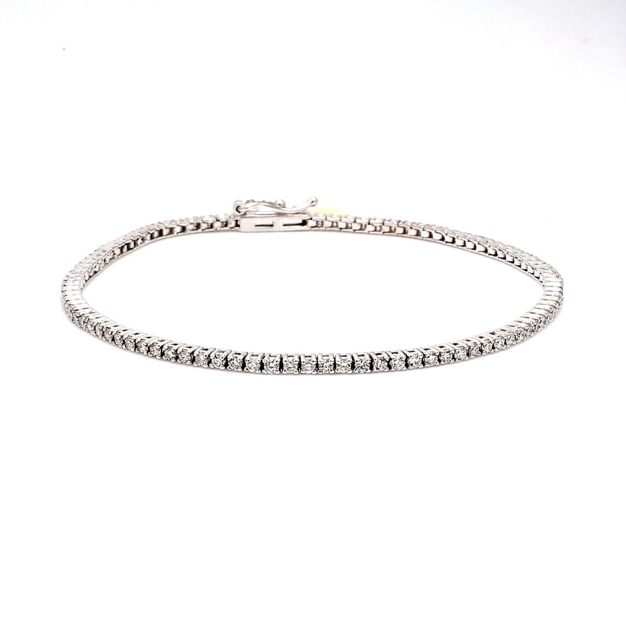 7' Tennis bracelet in 1K WG 4-prong set (69) round diamonds.  D3.26ct.t.w.