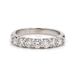 7-stone band in platinum with shared prong set round diamonds.  D0.59ct.t.w.