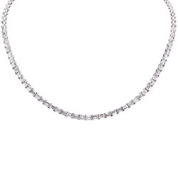 18' Tennis necklace east west style with basket prong set (136) emerald cut diamonds.  D14.26ct.t.w.