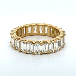 Eternity band in 18K YG with U-prong set (23) emerald cut diamonds.  D5.02ct.t.w.  Size 7