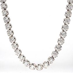 18' Tennis necklace with illusion head 4-prong set (133) round diamonds.  D6.73ct.t.w.