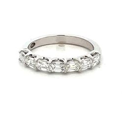 7-stone band east west style in 18K WG with prong set emerald cut diamonds.  D0.99ct.t.w.  Size 5