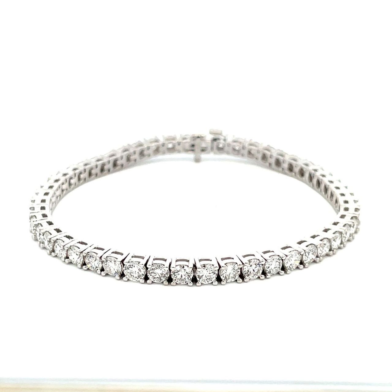 7' Tennis bracelet in platinum with 4-prong basket set (50) round diamonds.  D9.87ct.t.w.